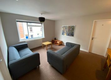 Bright And Inviting Living Room Featuring Comforta...
