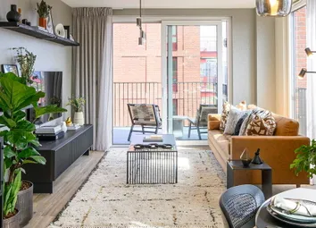Living Space With Sofa And Coffee Table Adjacent To Balcony Doors, Dining Table And Shelving In