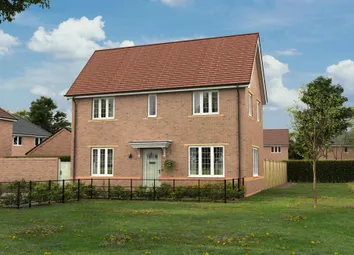 A Two-Story Brick House With A Red Tile Roof Sits On A Grassy Lawn