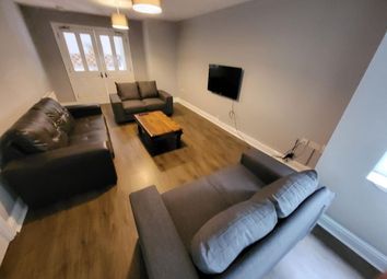 Spacious And Inviting Living Room Featuring Comfor...