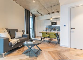 A Spacious And Stylish Living Room With Modern Dec...