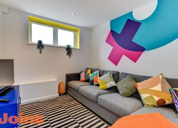 Modern And Vibrant Living Room Featuring A Spaciou...