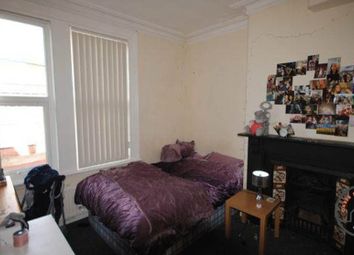 A Spacious, Well-Lit Master Bedroom Featuring A La...