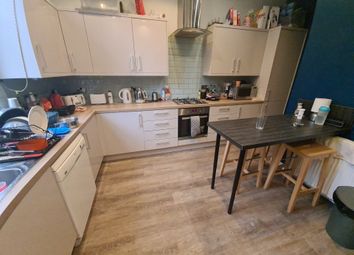 A Well-Equipped Kitchen Featuring Modern Appliance...