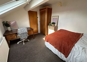 A Cozy Bedroom Featuring A Comfortable Double Bed ...