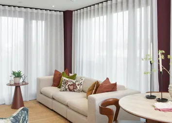 Living Space With Curtain Blinds Wrapped Around Corner, Dining Table In Adjacent.