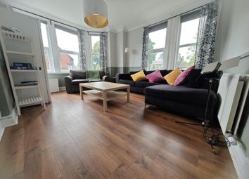 Bright And Spacious Living Room Featuring Large Ba...