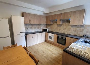 Bright And Tidy Kitchen Featuring Wooden Cabinetry...