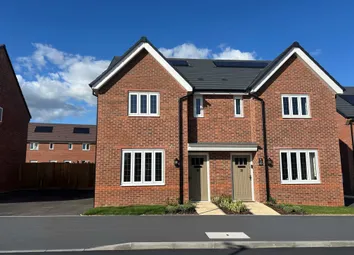 A Pair Of Modern Red-Brick Semi-Detached Houses With White-Framed Windows Stand Under A Blue Sky Wit
