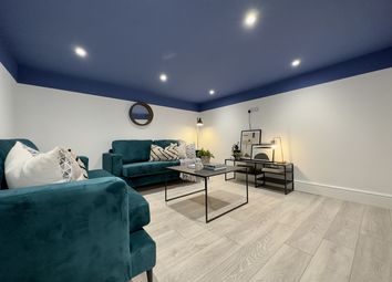 A Spacious And Inviting Modern Living Room Featuri...