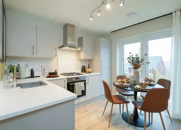 A Modern Kitchen With A White Countertop And Stainless Steel Appliances In The Foreground Is Complem