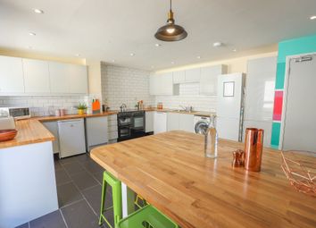 A Modern Kitchen Featuring Sleek Cabinetry And Amp...