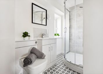 A Beautifully Designed Bathroom Featuring A Modern...