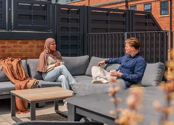 Horlicks Quarter Residents Enjoying The Rooftop Seating Area