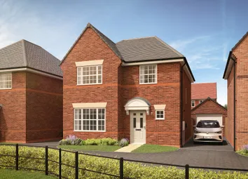 A Red Brick House With A White Door And Garage Sits Behind A Black Metal Fence
