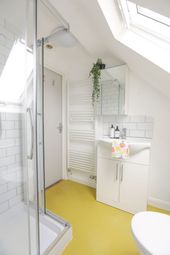 A Bright And Modern Bathroom Featuring A Spacious ...