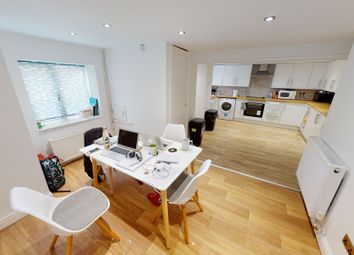 A Bright And Welcoming Living Room Featuring Moder...