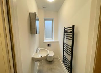 Modern Bathroom Featuring Sleek Fixtures And Ample...