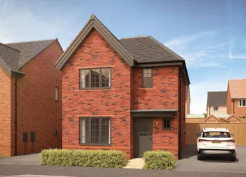 A Modern Brick House With Manicured Hedges In The Foreground Sits On A Street With Other Houses And