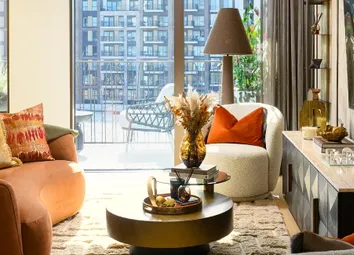 Modern Living Space With Fabric Seating, TV Stand, Ample Natural Lighting From Windows
