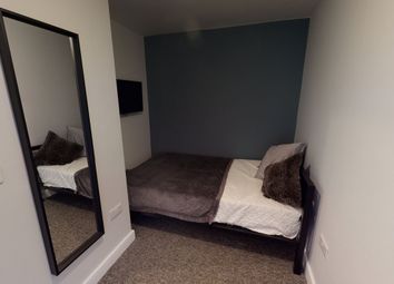 A Cozy Double Bedroom Featuring Modern Decor And A...
