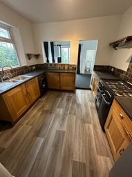 Bright Kitchen Featuring Wood Cabinetry And Modern...