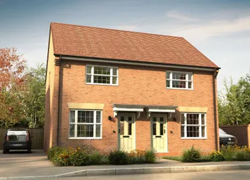A Two-Story Brick House With A Red Tile Roof