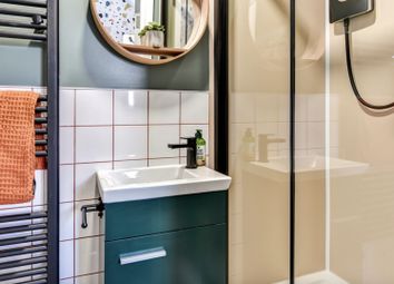 This Stylish Bathroom Features A Sleek Shower And ...