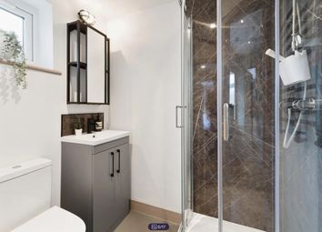 A Modern And Stylish Bathroom Featuring A Sleek Sh...