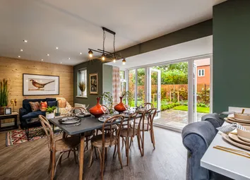 Open Plan Kitchen With Dining Table And French Doors Showing The Garden