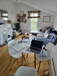 Bright And Cozy Living Room Featuring A Comfortabl...