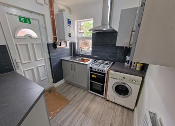 A Compact, Modern Kitchen Featuring Clean Countert...