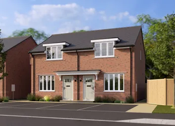 A Pair Of Modern Brick Semi-Detached Houses With Manicured Front Gardens And A Wooden Fence Stand Ag