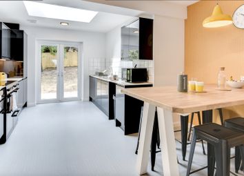 This Modern Kitchen Features Sleek Black Cabinetry...