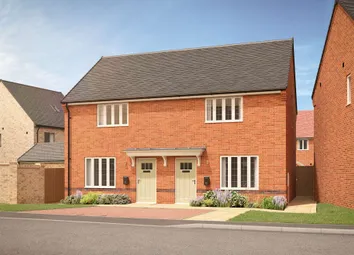 A Pair Of Modern Brick Semi-Detached Houses With Manicured Gardens And A Paved Driveway Are Set Agai