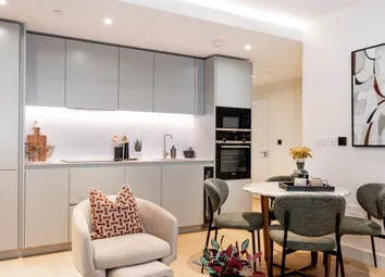 Living Space In Foreground, Kitchenette, Dining Table And Shelving In Background