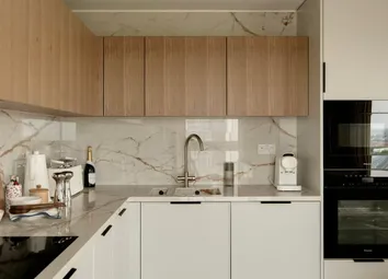 Kitchen With Marble Textured Splashback Tiles, Mod Con Appliances, Off-White And Wooden Design.