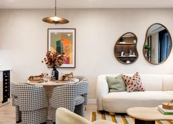 From Left: Kitchenette, Dining Table, L-Shaped Sofa, Coffee Table, Balcony Doors