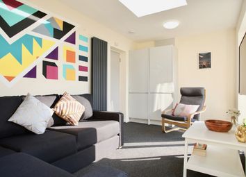 This Vibrant Living Room Features A Cozy Seating A...