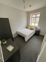 A Cozy Double Bedroom Featuring A Comfortable Bed ...
