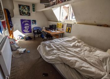 Cozy Single Bedroom With A Slanted Ceiling And Two...