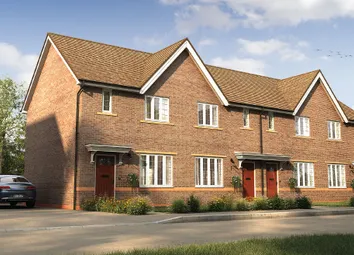 A Row Of Modern, Brick-Built Townhouses With Gabled Roofs And Driveways In The Foreground