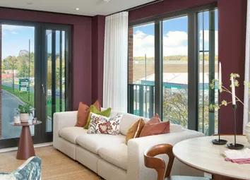 Modern Designed Living Space With Sofa And Coffee Table, Dining Table Adjacent And Balcony Behind.