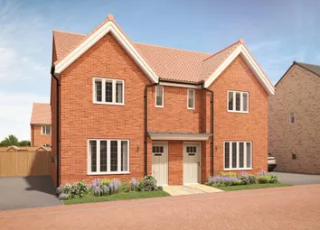 A Pair Of Red Brick Semi-Detached Houses With White-Framed Windows And White Doors Stand In The Fore