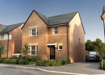 A Two-Story Brick House With A Slanted Roof And A Car Parked In The Driveway