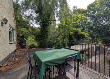 A Peaceful Garden Terrace With Outdoor Seating Sur...