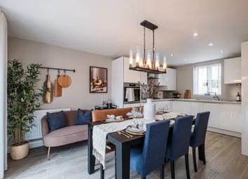 Modern Kitchen With White Cupboards And Dining Table