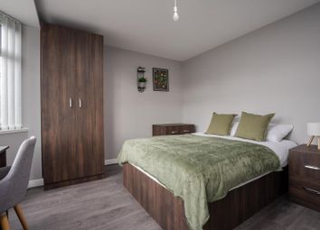 A Cozy Double Bedroom Featuring A Comfortable Bed ...