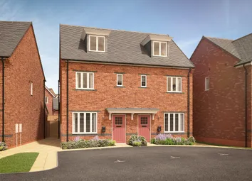 A Pair Of Modern Brick Townhouses With Pink Doors And Dormer Windows Stand In The Foreground