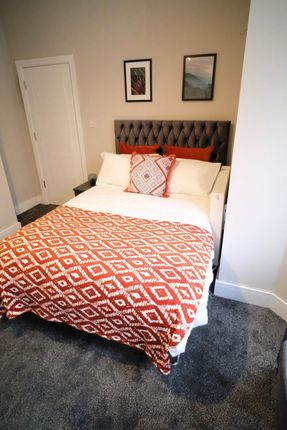 Bright And Cozy Double Bedroom Featuring A Plush G...